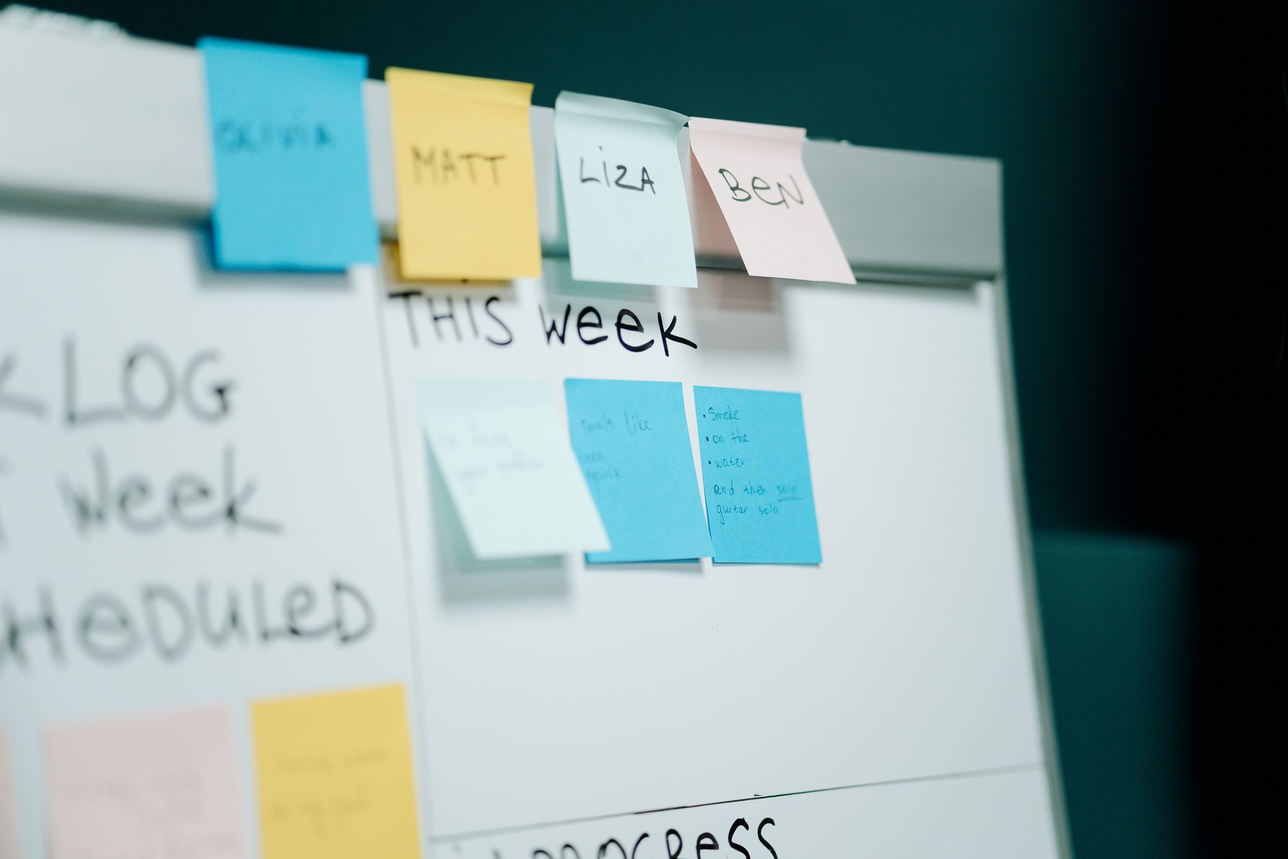 Whiteboard covered in sticky notes and sketches during a design system planning session